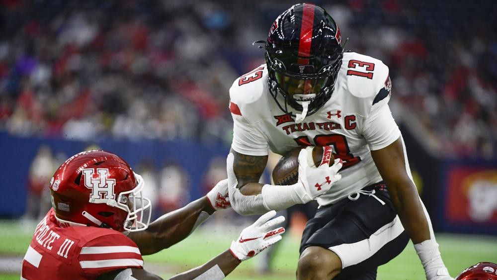 Texas Tech wide receiver Erik Ezukanma (13) runs with the ball against Houston during the first half of an NCAA college football game Saturday, Sept. 4, 2021, in Houston. (AP Photo/Justin Rex)