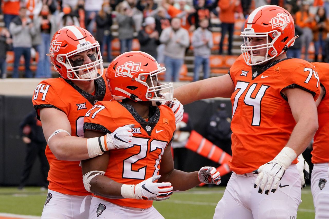 Jackson's 3 TD runs lead No. 21 Oklahoma St past Texas Tech