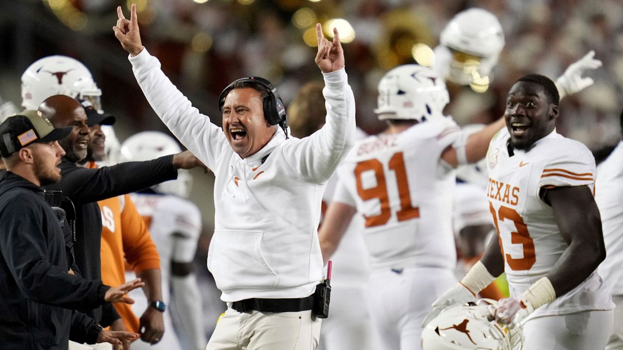 Texas head coach Steve Sarkisian, center left, reacts as his team recovers a fumble late in the fourth quarter of an NCAA college football game against Texas A&M, Saturday, Nov. 30, 2024, in College Station, Texas. (AP Photo/Sam Craft)