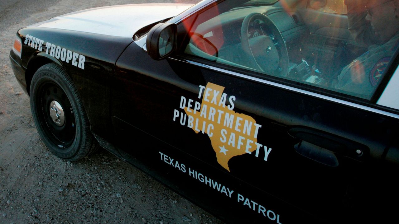 In this April 6, 2008, file photo, a Texas State Trooper is shown sitting in his vehicle in Eldorado, Texas. (AP Photo/Tony Gutierrez, File)