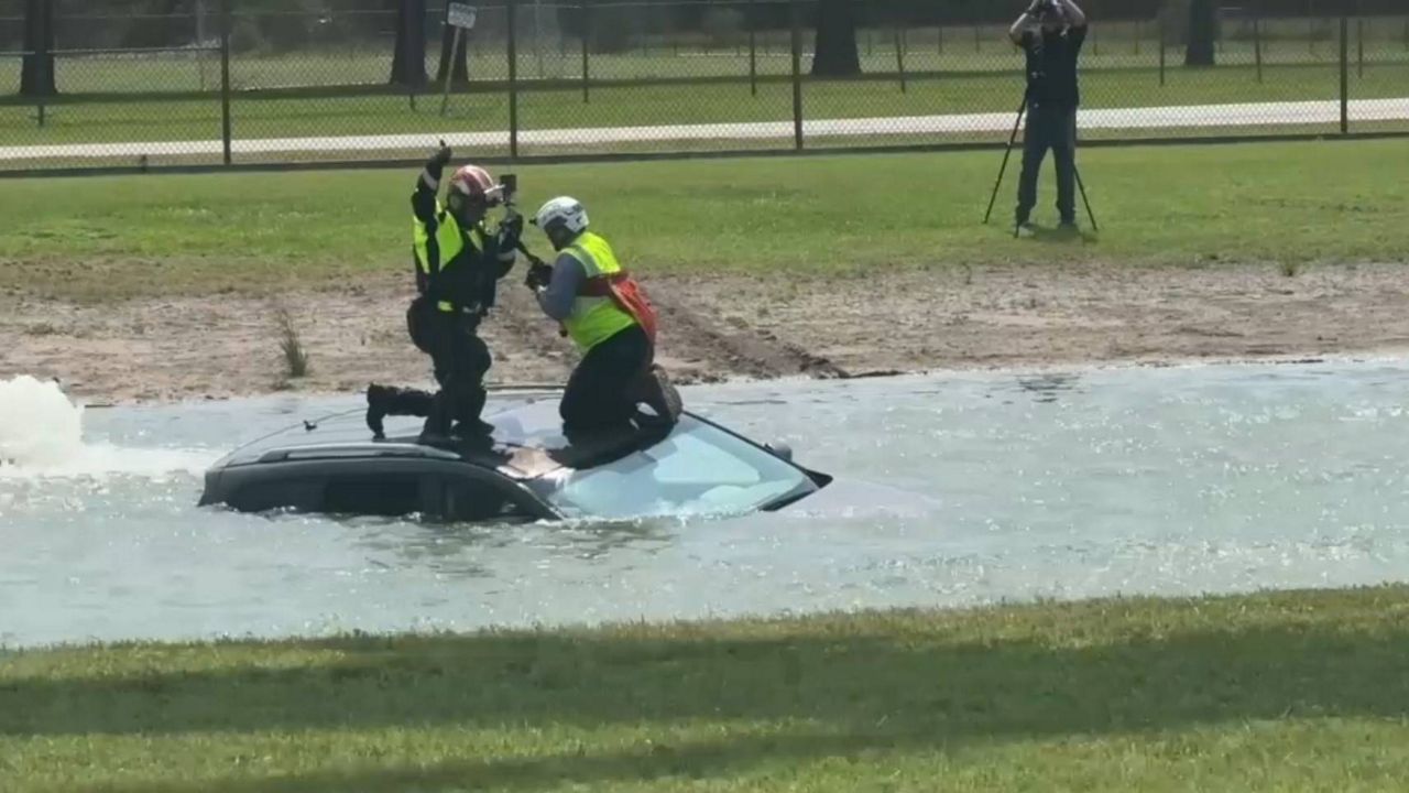 First responders simulate a flood water rescue. (Spectrum News 1/John Salazar)