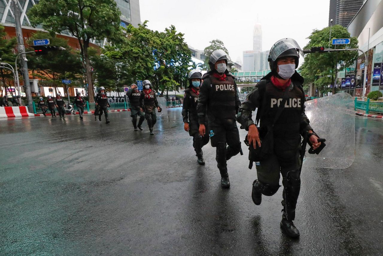 2 charged with endangering queen as Thai protests continue