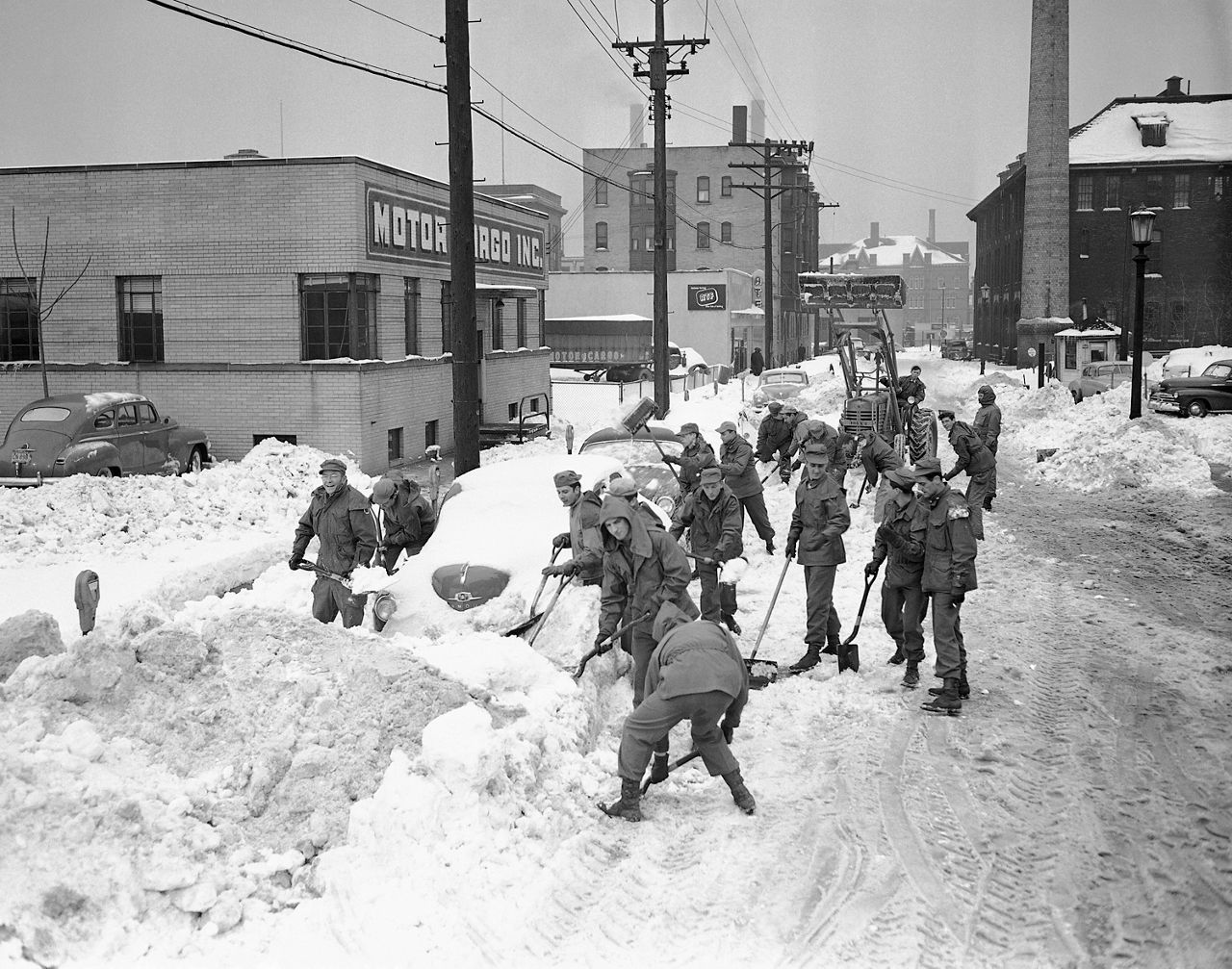 Units of the 112th engineers of the Ohio National Guard use shovels to help free snow bound streets of Cleveland, Ohio, November 28, 1950. Weekend storm caused one of worst traffic jams in Cleveland's history. (AP Photo)