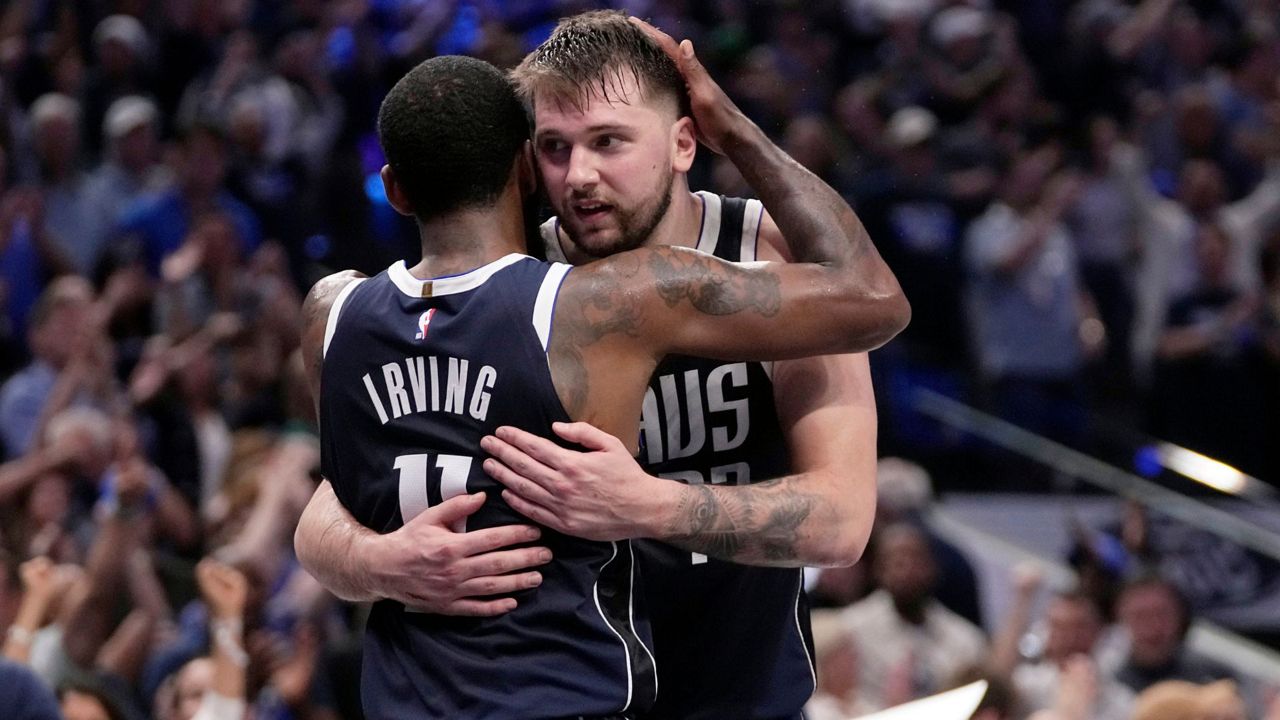 Dallas Mavericks' Kyrie Irving (11) and Luka Doncic, right, celebrate the team's win in Game 3 of an NBA basketball second-round playoff series against the Oklahoma City Thunder, Saturday, May 11, 2024, in Dallas. (AP Photo/Tony Gutierrez)