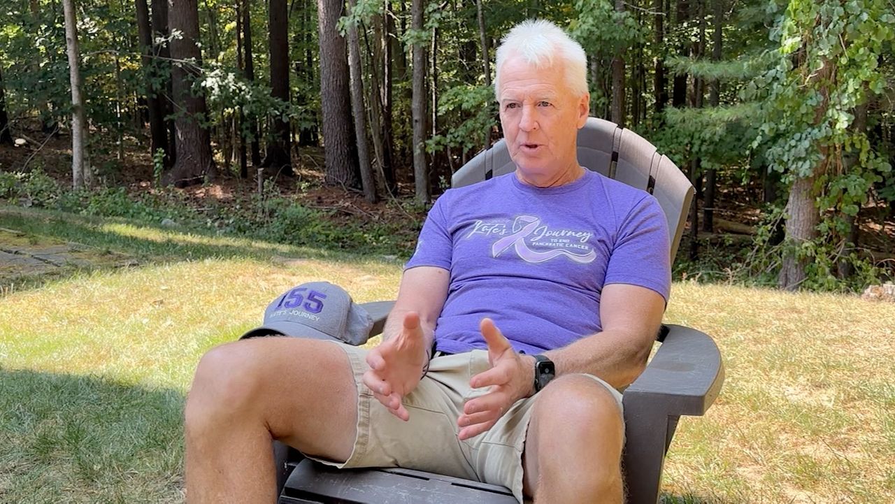 Tim Duffy, 67, sits outside his Ogunquit home Thursday to describe "Kate's Journey," the charity walk to raise money for pancreatic cancer research he has organized to start on Ogunquit Beach on Saturday, Sept. 21. The 5k walk is named for his wife, who died of the disease in 2022. (Spectrum News/Sean Murphy)