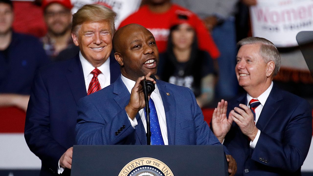 Sen. Tim Scott, R-S.C., speaks in front of President Donald Trump and Sen. Lindsey Graham, R-S.C., during a campaign rally, Friday, Feb. 28, 2020, in North Charleston, S.C. When Scott launched his campaign for the White House last week, the notoriously prickly former President Donald Trump welcomed his new competitor with open arms. “Good luck to Senator Tim Scott in entering the Republican Presidential Primary Race,” Trump said. (AP Photo/Patrick Semansky, File)