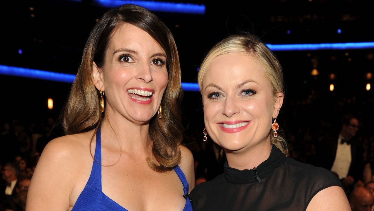 Tina Fey and Amy Poehler in the audience at the 65th Primetime Emmy Awards at Nokia Theatre on Sunday Sept. 22, 2013, in Los Angeles. (Photo by Frank Micelotta/Invision for Academy of Television Arts & Sciences/AP Images)