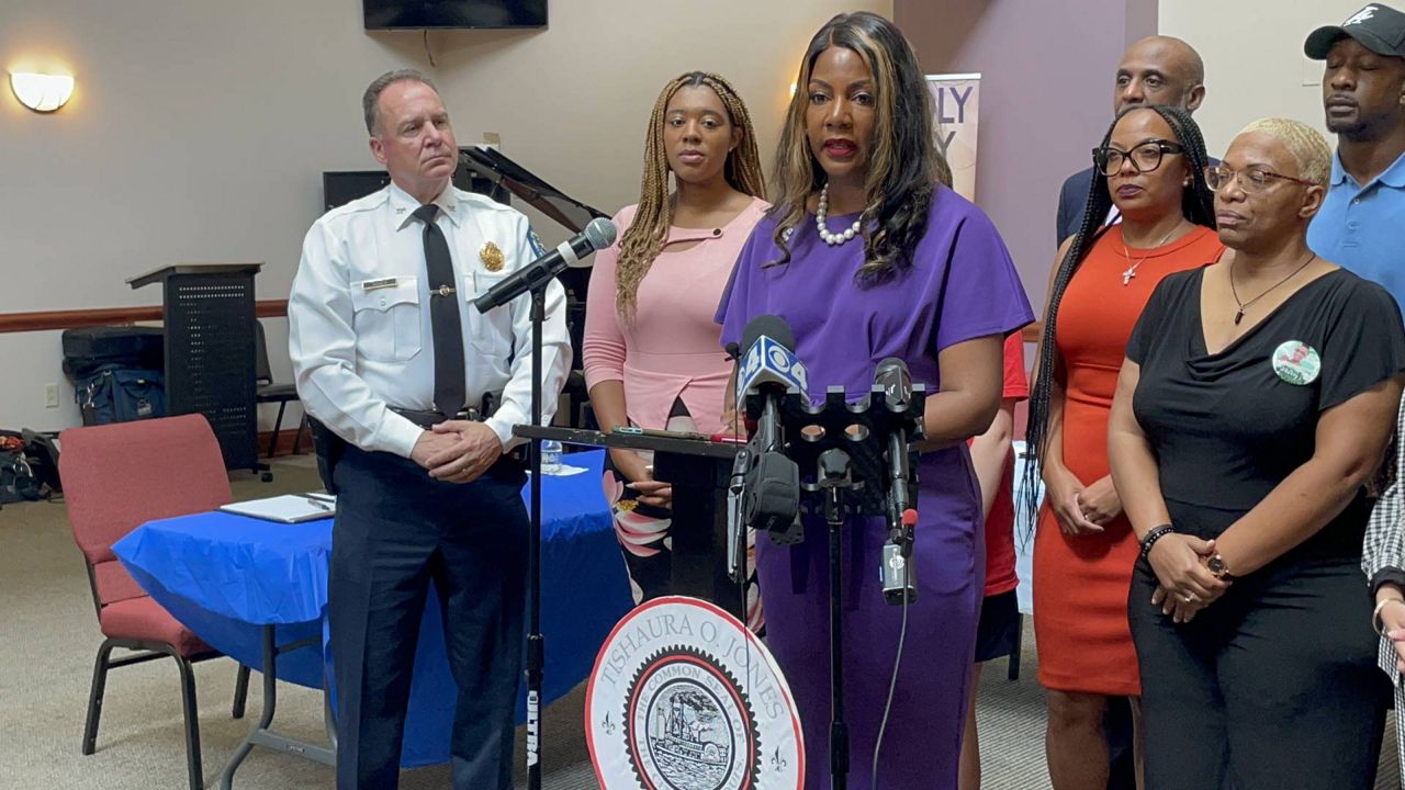 St. Louis Mayor Tishaura Jones, joined by SLMPD Chief Robert Tracy, members of the Board of Aldermen and survivors of gun violence, said Tuesday her administration would back aldermanic proposals this fall that would ban "military-grade" weapons in the city, in addition to other gun violence prevention measures. (Spectrum News/Gregg Palermo)