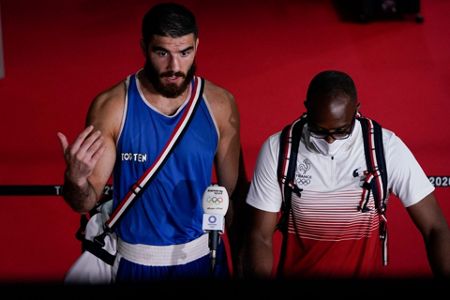 Mourad Aliev of Team France reacts after losing by