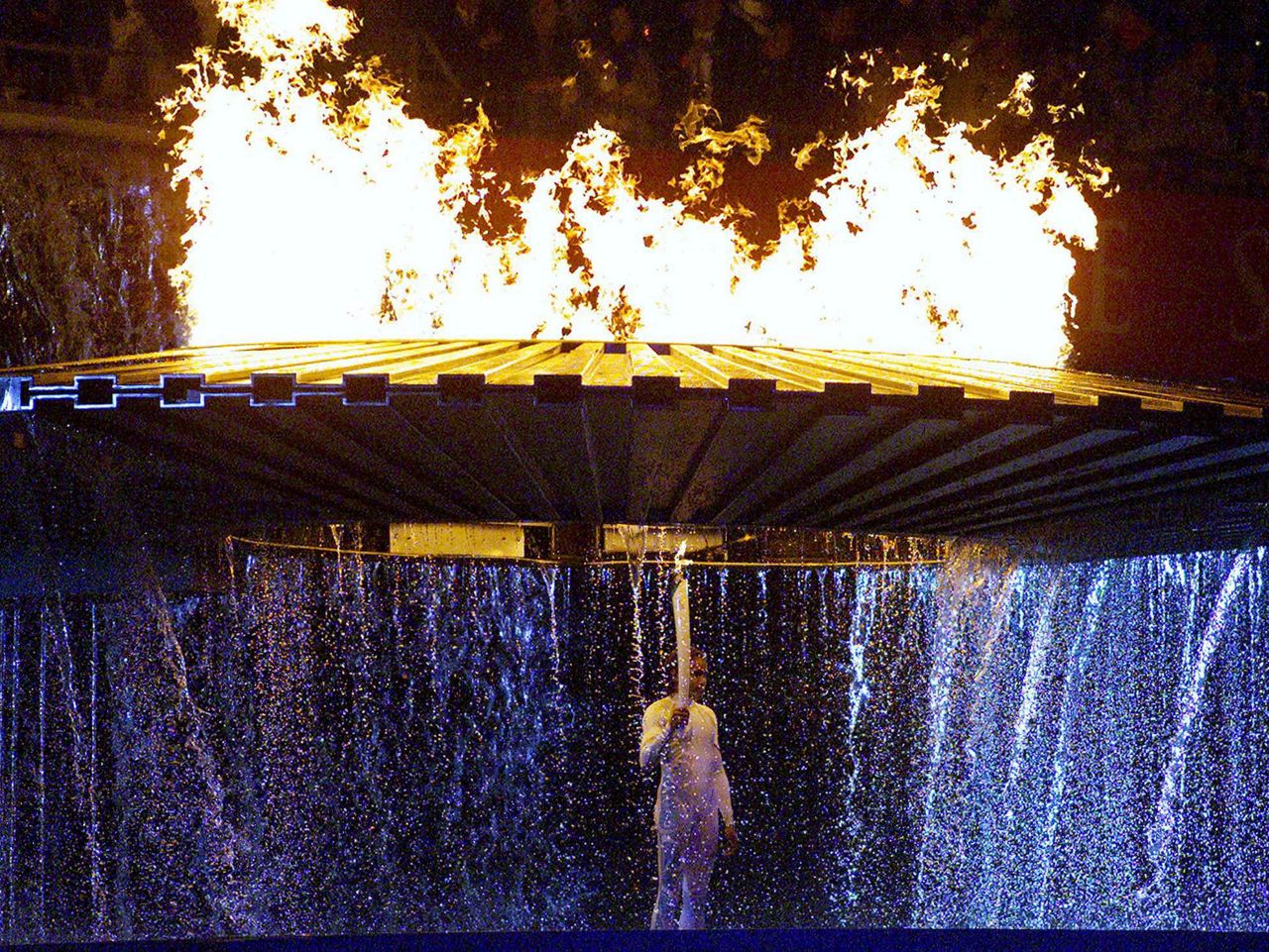 AP PHOTOS Nearly 100 years of lighting the Olympic flame