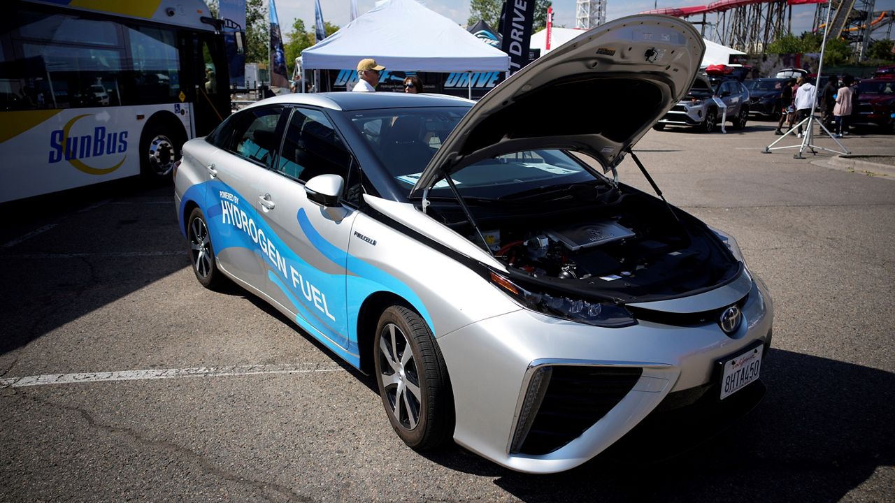 A 2021 Toyota Prius that runs on a hydrogen fuel cell sits on display at the Denver auto show on Sept. 17, 2021, at Elitch's Gardens in downtown Denver. (AP Photo/David Zalubowski, File)