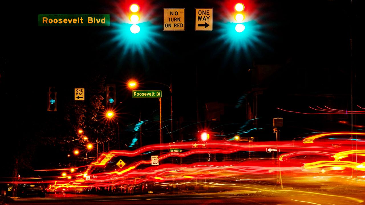 This long exposure photo shows traffic crossing Roosevelt Boulevard in Philadelphia, Wednesday, May 25, 2022. (AP Photo/Matt Rourke)