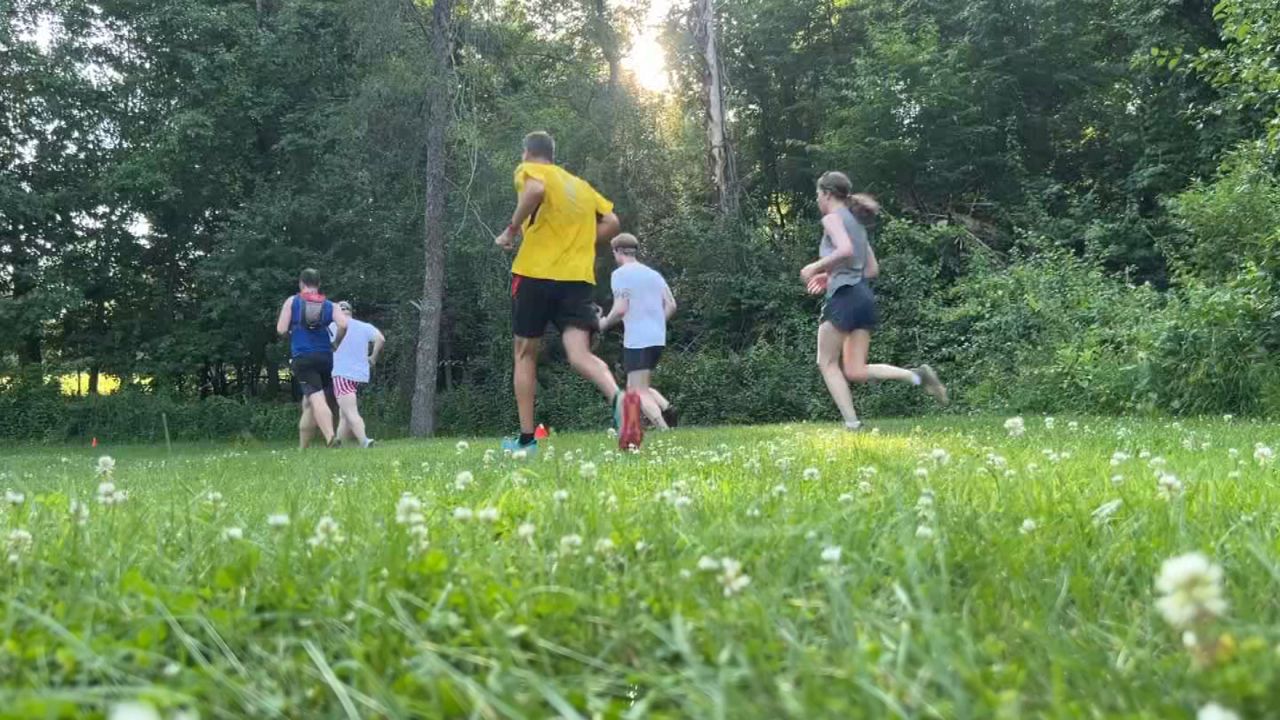 Runners running on a trail