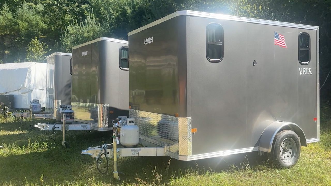 Small trailers such as these serve as temporary portable housing for homeless veterans in Maine. They came from an idea Ed Harmon, 76, a former US Navy sniper and Vietnam veteran, had five years ago. Now, he runs a nonprofit that delivers them to anywhere in the state.(Spectrum News/Sean Murphy)