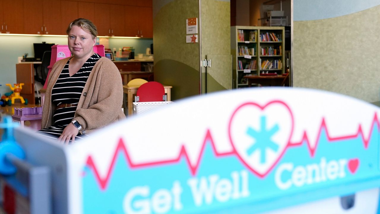 Dr. Katy Miller, the medical director of adolescent medicine for Children’s Minnesota, sits for a portrait at the hospital in Minneapolis, Thursday, June 29, 2023. The quest for gender-affirming care has been complicated, as bans on such care for minors are taking effect around the country. Clinics in states like Minnesota that have declared themselves refuges for transgender people are feeling the pressure. (AP Photo/Abbie Parr)