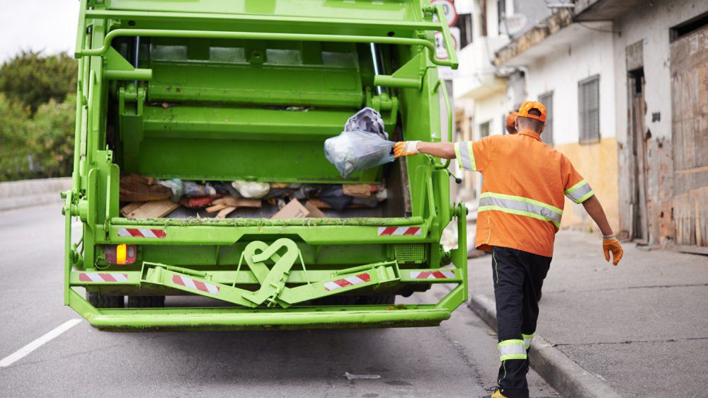 https://s7d2.scene7.com/is/image/TWCNews/Trash_collector_GettyImages_PeopleImages_HI_0708