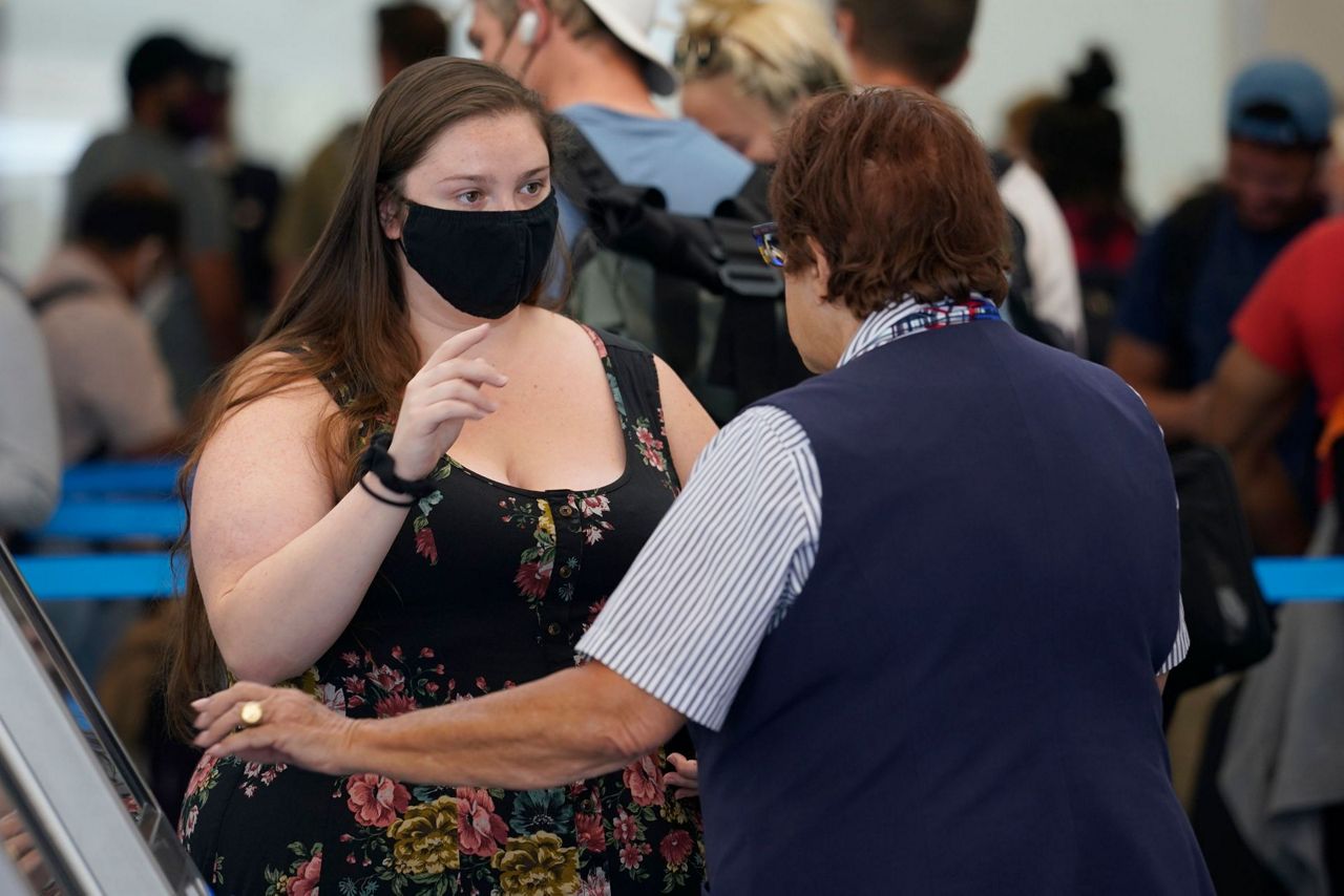 Majority of Americans want masks for travelers APNORC poll