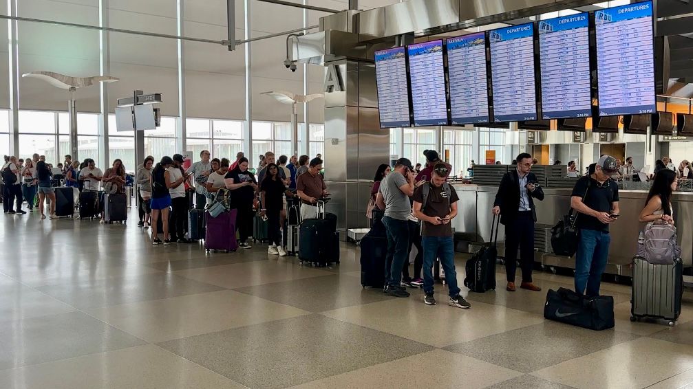 Travelers wait in line for hours at RDU.