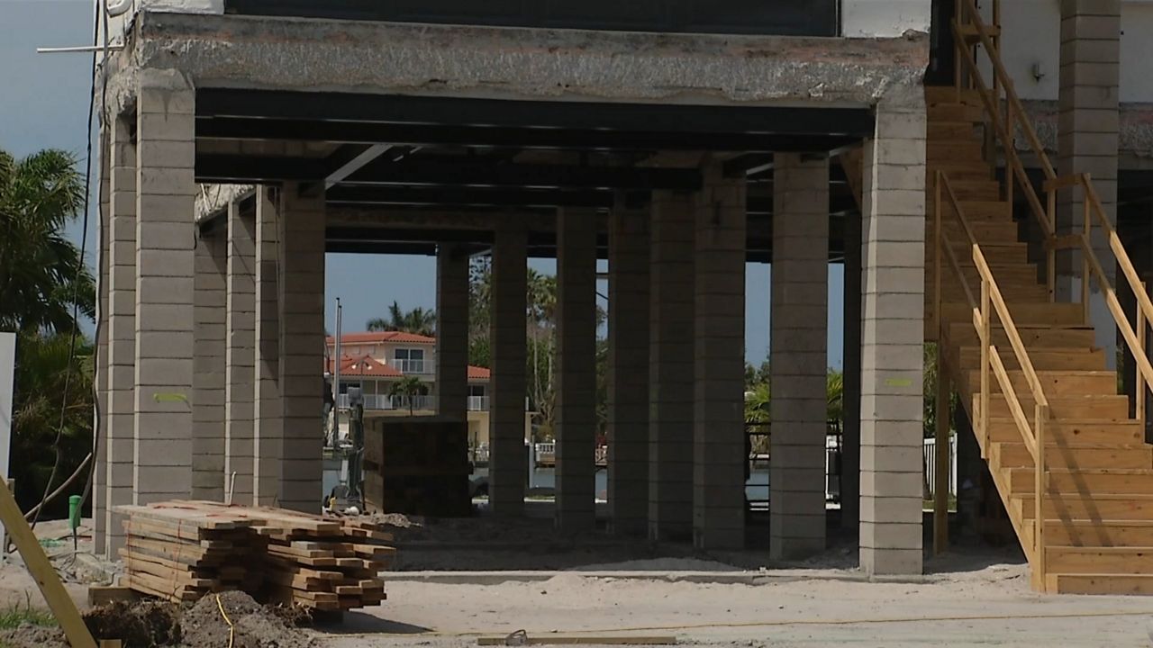 A hurricane-damaged Treasure Island home is being elevated. (Spectrum News/Eddie Jackson)