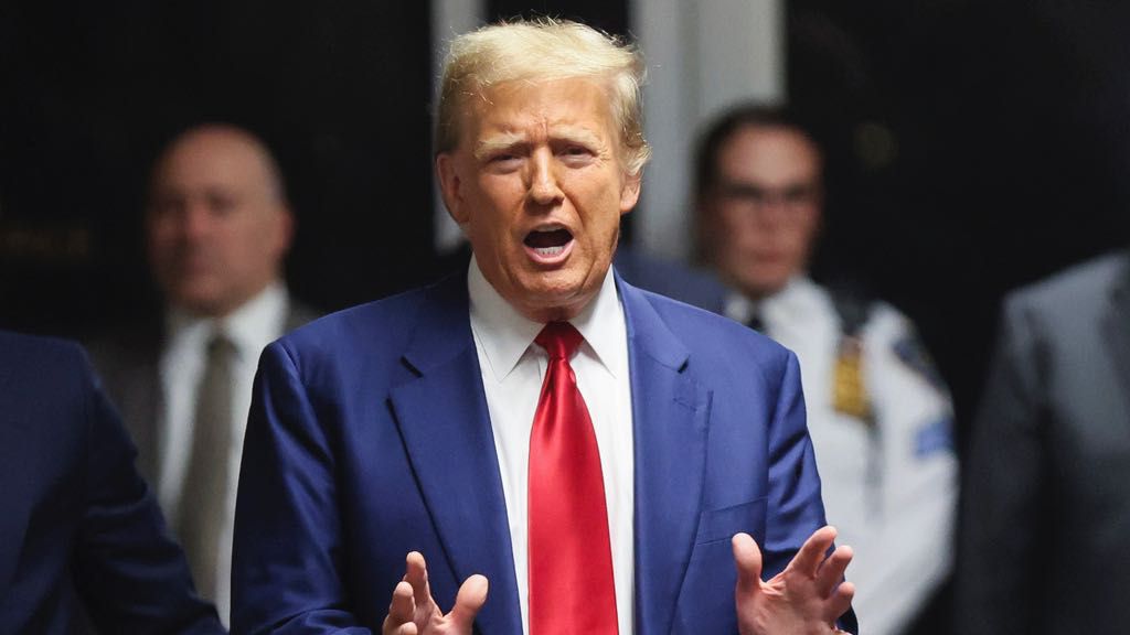 Former President Donald Trump speaks after hearing at New York Criminal Court, Monday, March 25, 2024, in New York. New York Judge Juan M. Merchan has scheduled an April 15 trial date in Trump's hush money case. (Brendan McDermid/Pool Photo via AP)