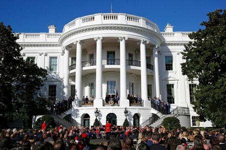 President Donald Trump, left, reacts as Washington Nationals catcher Kurt  Suzuki walks to a podium to speak during an event to honor the 2019 World  Series champion Nationals at the White House