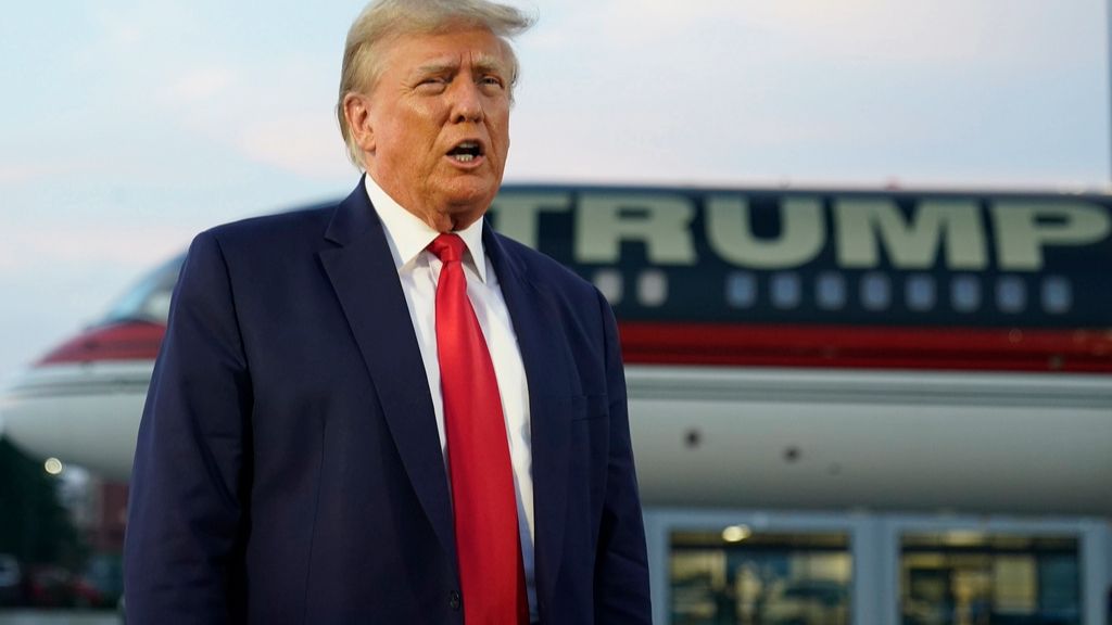 Former President Donald Trump speaks with reporters before departure from Hartsfield-Jackson Atlanta International Airport, Thursday, Aug. 24, 2023, in Atlanta. (AP Photo/Alex Brandon)