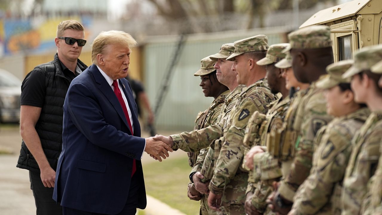 Republican presidential candidate former President Donald Trump greets members of the National Guard on the U.S.-Mexico border, Feb. 29, 2024, in Eagle Pass, Texas. Recent statements by Trump have fueled Democrats' sense that there's an opening among voters with strong military ties, and progressive veterans' organizations are working to bridge the gap with what has long been a reliably red constituency. (AP Photo/Eric Gay, File)