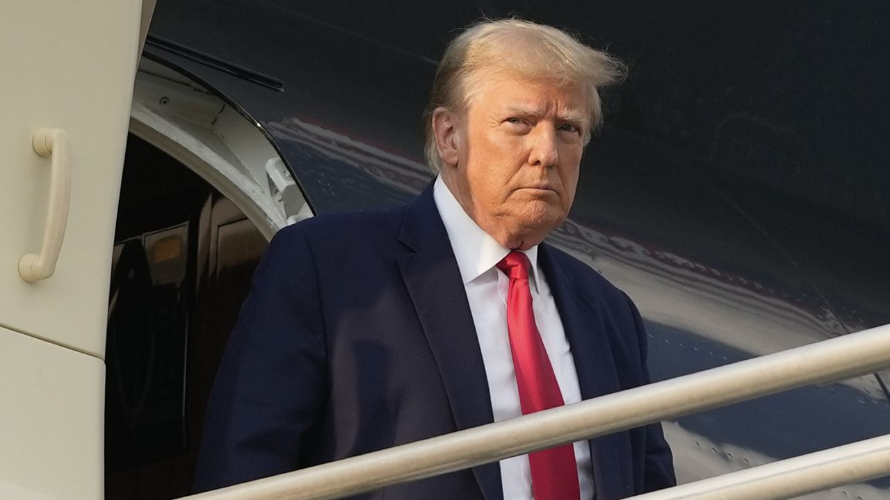 Former President Donald Trump steps off his plane on Aug. 24, 2023, as he arrives at Hartsfield-Jackson Atlanta International Airport. (AP Photo/Alex Brandon)