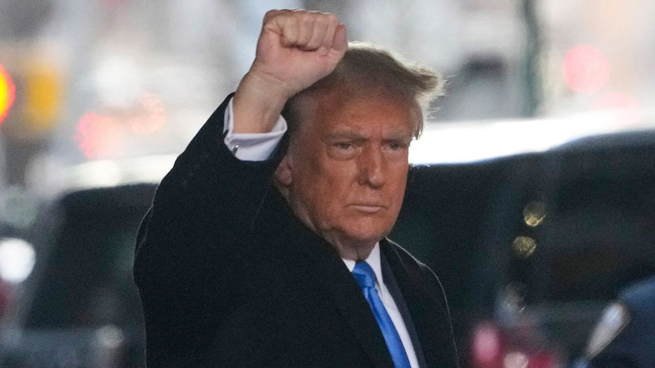 Former President Donald Trump leaves his apartment building in New York, Monday, Jan. 22, 2024. (AP Photo/Seth Wenig)