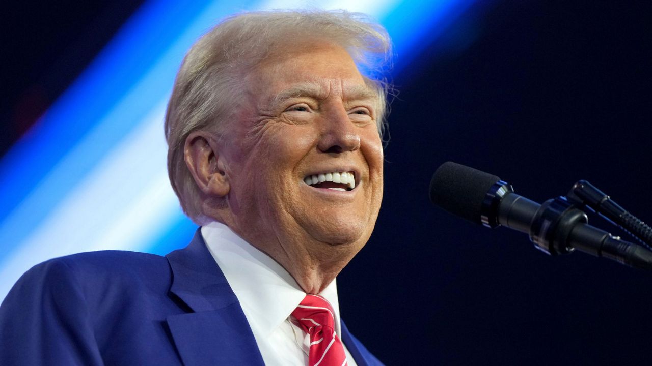 President-elect Donald Trump speaks at AmericaFest, Sunday, Dec. 22, 2024, in Phoenix. (AP Photo/Rick Scuteri)