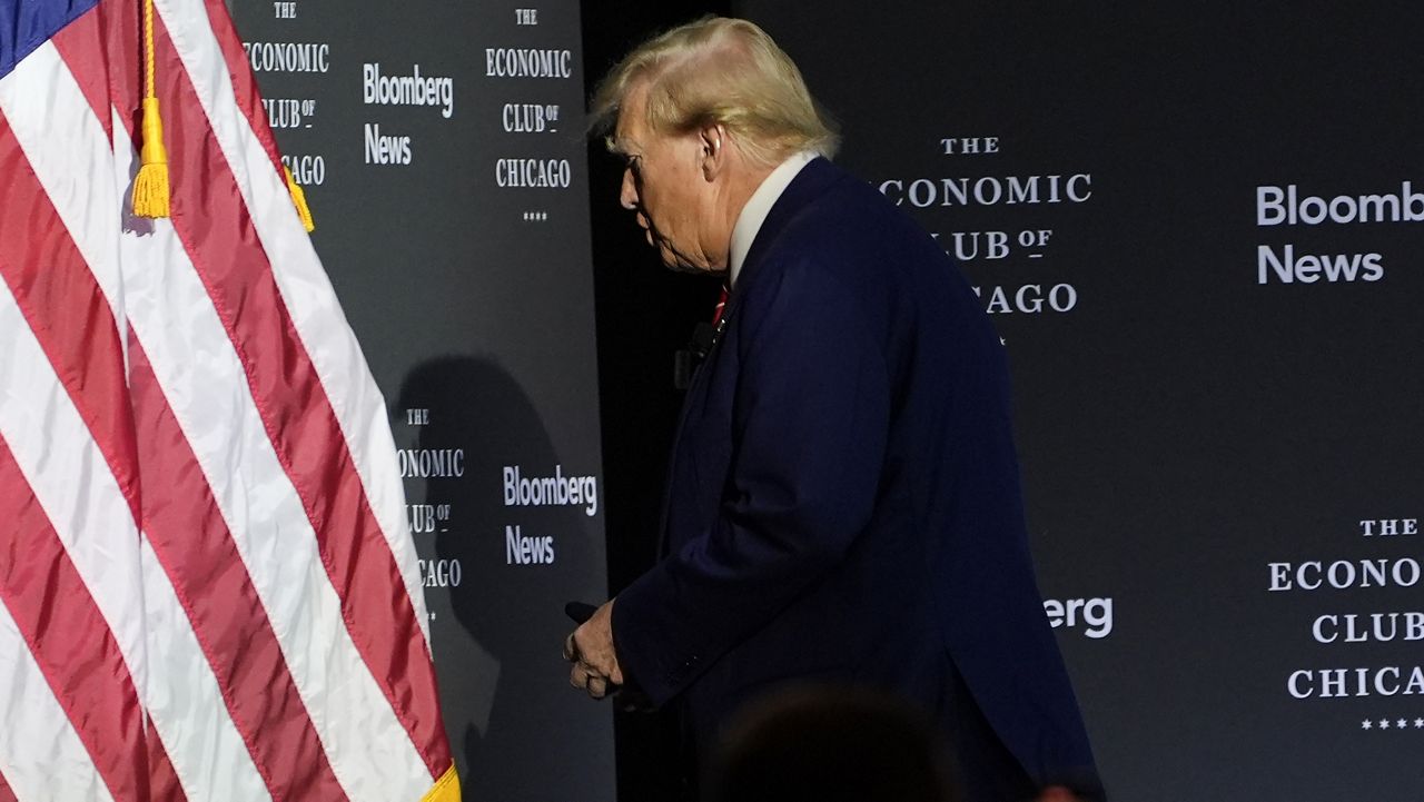 Republican presidential nominee former President Donald Trump walks off after an interview with Bloomberg News Editor-in-Chief John Micklethwait during an event with the Economic Club of Chicago, Tuesday, Oct. 15, 2024, in Chicago. (AP Photo/Evan Vucci)