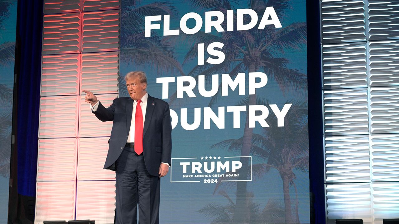 Former President Donald Trump acknowledges attendees before speaking at the Republican Party of Florida Freedom Summit, Saturday, Nov. 4, 2023, in Kissimmee, Fla. (AP Photo/Phelan M. Ebenhack)