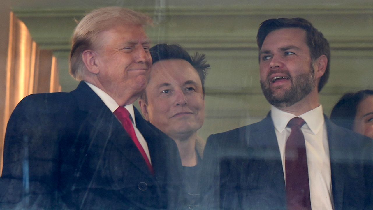 President-elect Donald Trump, from left, billionaire Elon Musk and Vice President-elect JD Vance attend the NCAA college football game between Army and Navy at Northwest Stadium in Landover, Md., Saturday, Dec. 14, 2024. (AP Photo/Stephanie Scarbrough)