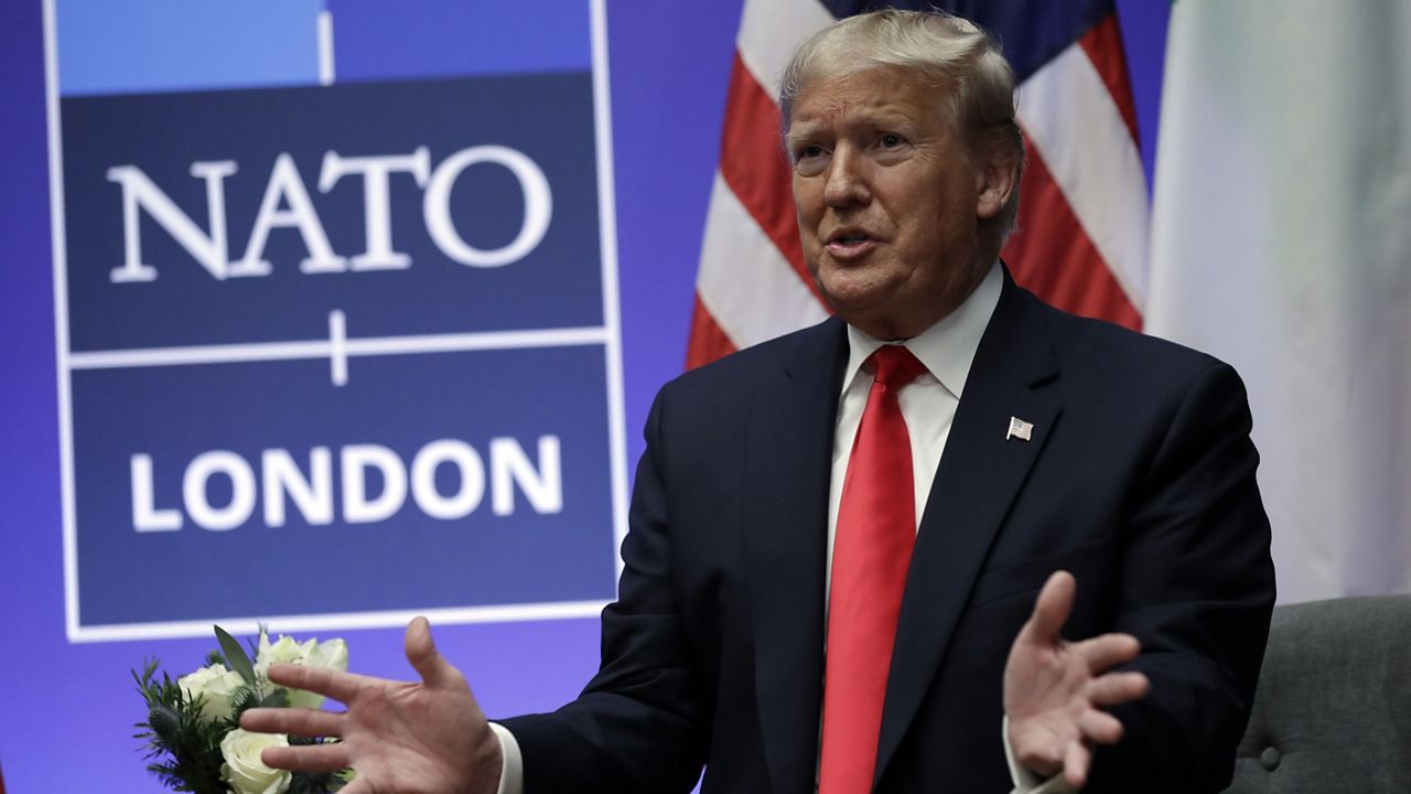 President Donald Trump meets with Italian Prime Minister Giuseppe Conte during the NATO summit at The Grove, Wednesday, Dec. 4, 2019, in Watford, England. (AP Photo/ Evan Vucci)