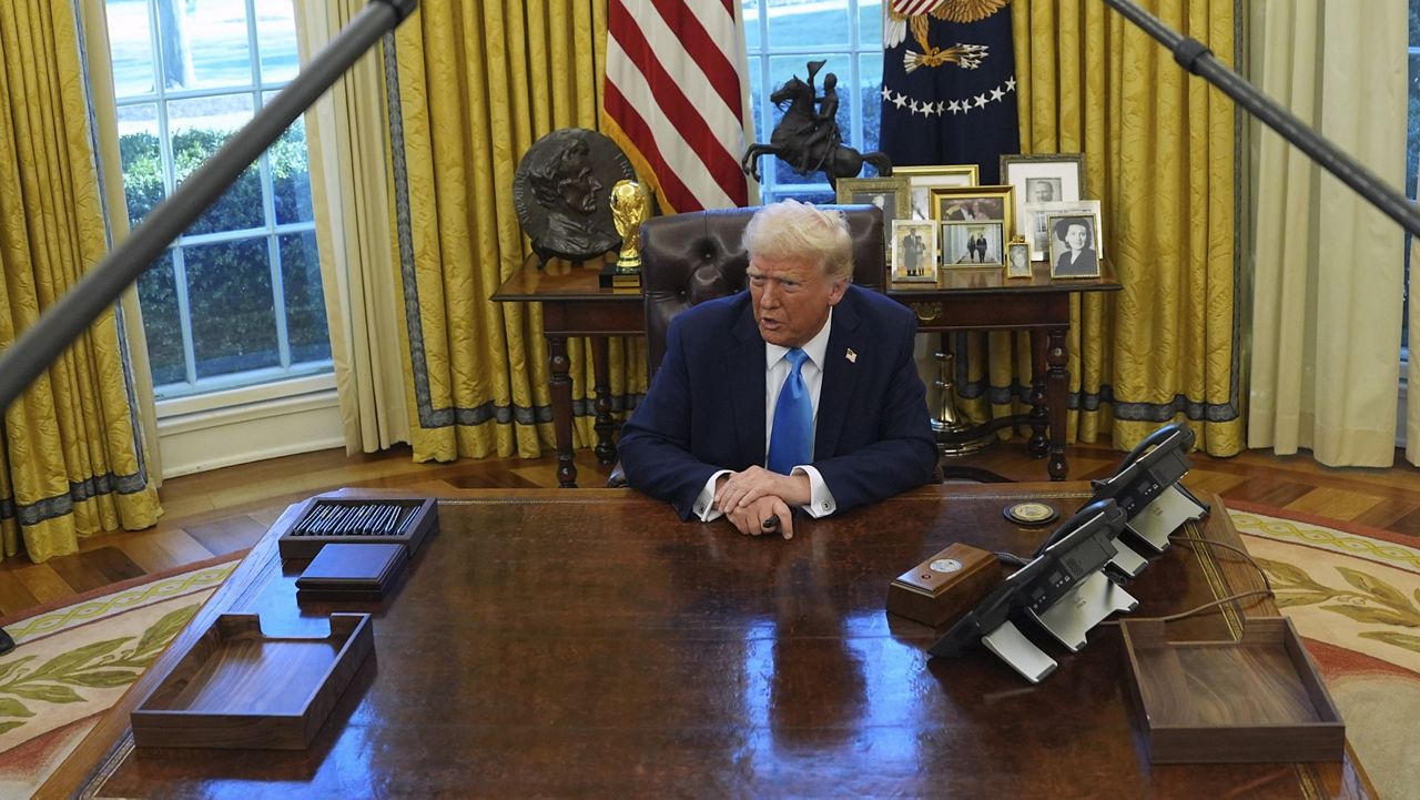 President Donald Trump speaks to reporters as he signs executive orders in the Oval Office of the White House, Tuesday, Feb. 4, 2025, in Washington. (AP Photo/Evan Vucci)