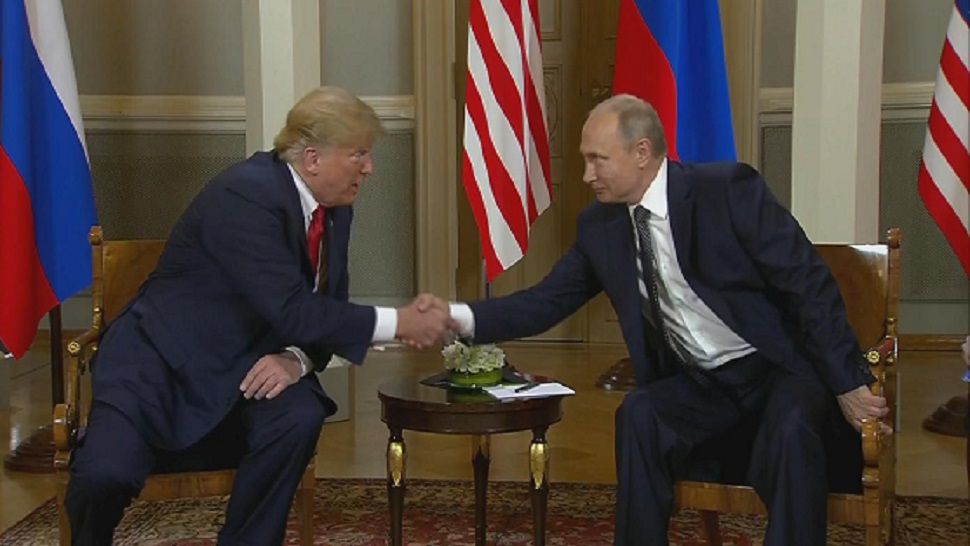 President Donald Trump and Russian President Vladimir Putin shake hands Monday, July 16, 2018. (AP Photo)