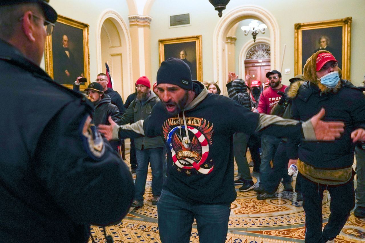 Trump openly embraces, amplifies QAnon conspiracy theories