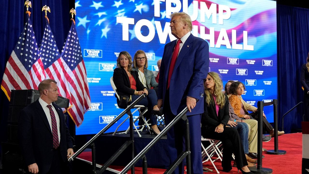 Republican presidential nominee former President Donald Trump checks on a person having a medical emergency at a campaign town hall at the Greater Philadelphia Expo Center & Fairgrounds, Monday, Oct. 14, 2024, in Oaks, Pa. (AP Photo/Alex Brandon)