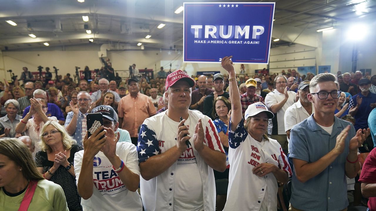 Audience members react during a fundraising event for U.S. Rep. Ashley Hinson, R-Iowa, Sunday, Aug. 6, 2023, in Cedar Rapids, Iowa. (AP Photo/Charlie Neibergall)