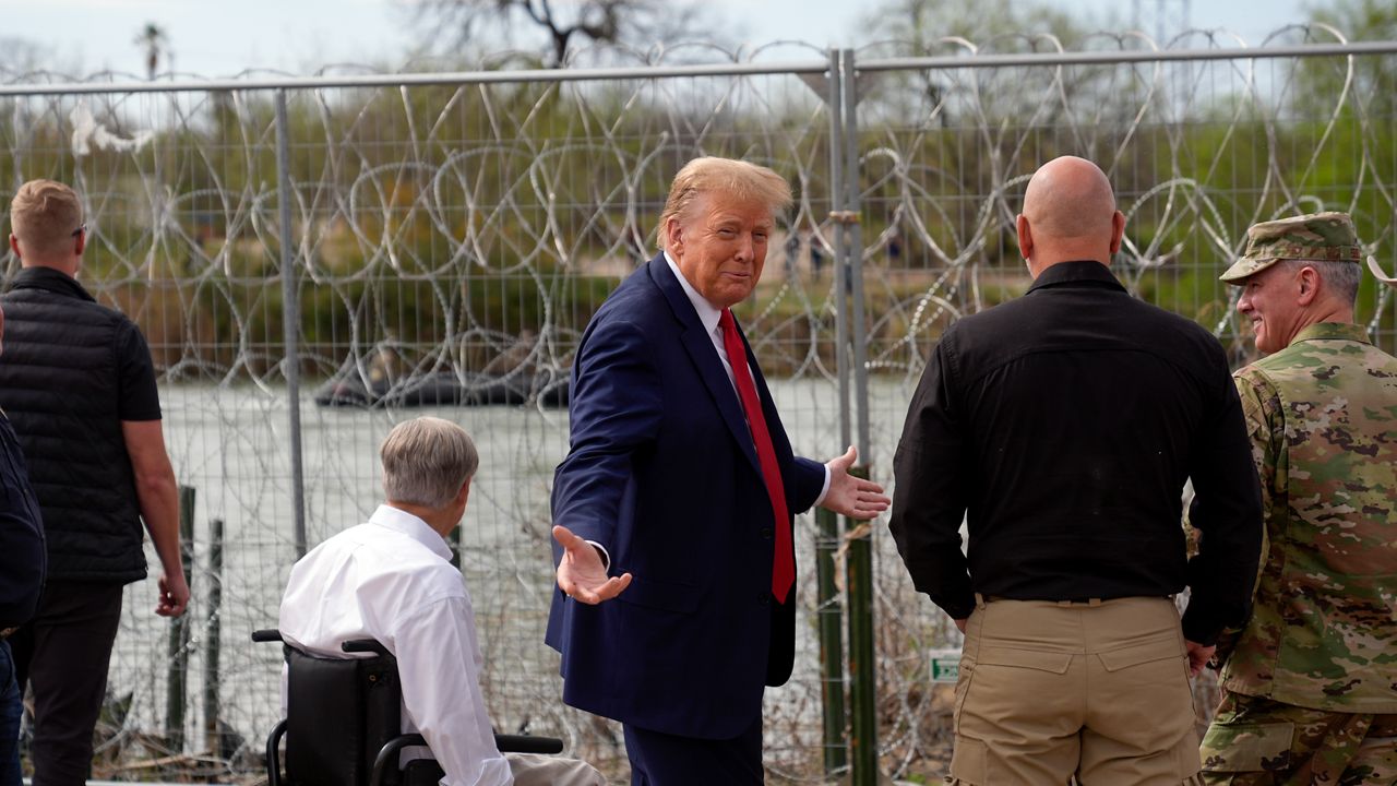 Republican presidential candidate former President Donald Trump gestures near the bank of the Rio Grande River at Shelby Park during a visit to the U.S.-Mexico border, Thursday, Feb. 29, 2024, in Eagle Pass, Texas. (AP Photo/Eric Gay)