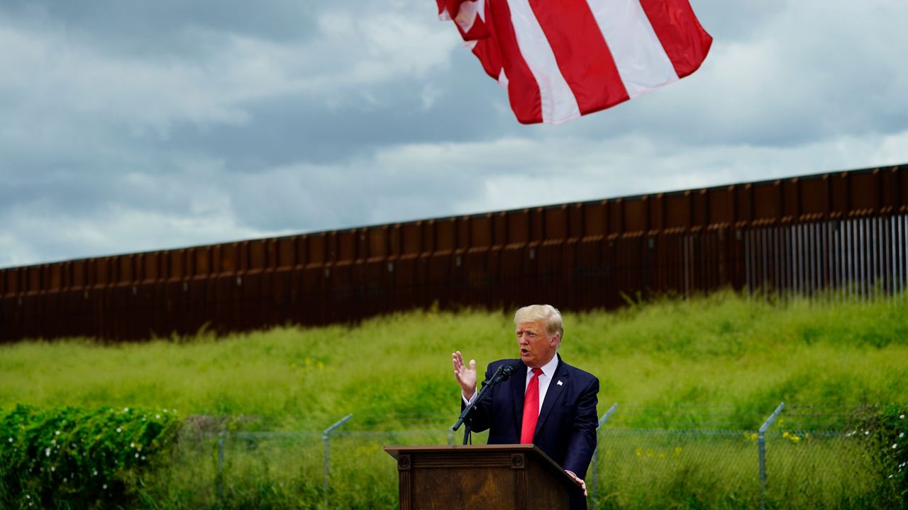 President Donald Trump speaks during a visit to an unfinished section of border wall with Texas Gov. Greg Abbott, in Pharr, Texas, June 30, 2021. (AP Photo/Eric Gay, File)