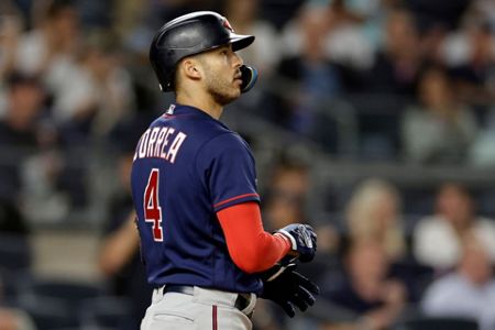 New York Yankees' Isiah Kiner-Falefa reacts after hitting a grand slam  during the fourth inning of the second baseball game of a doubleheader  against the Minnesota Twins on Wednesday, Sept. 7, 2022