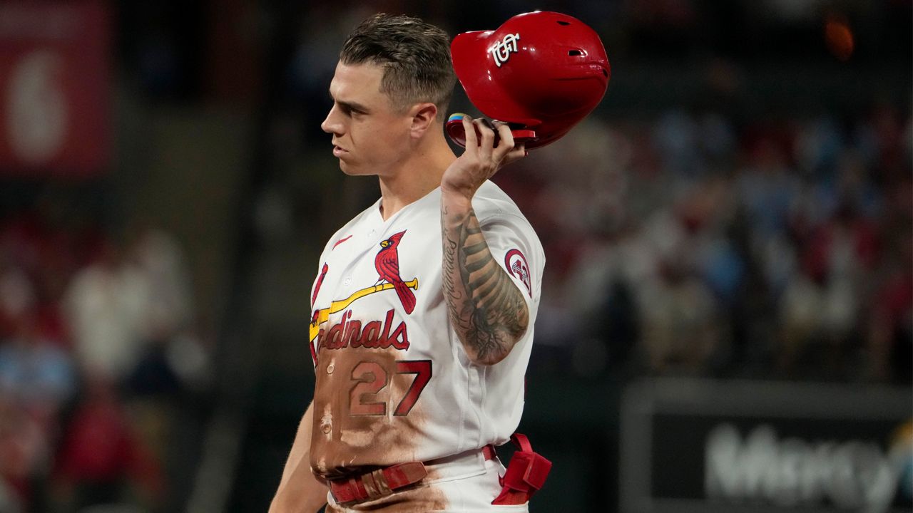 St. Louis Cardinals' Tyler O'Neill removes his helmet after flying out to end the fifth inning of a baseball game against the Atlanta Braves Monday, April 3, 2023, in St. Louis. (AP Photo/Jeff Roberson)