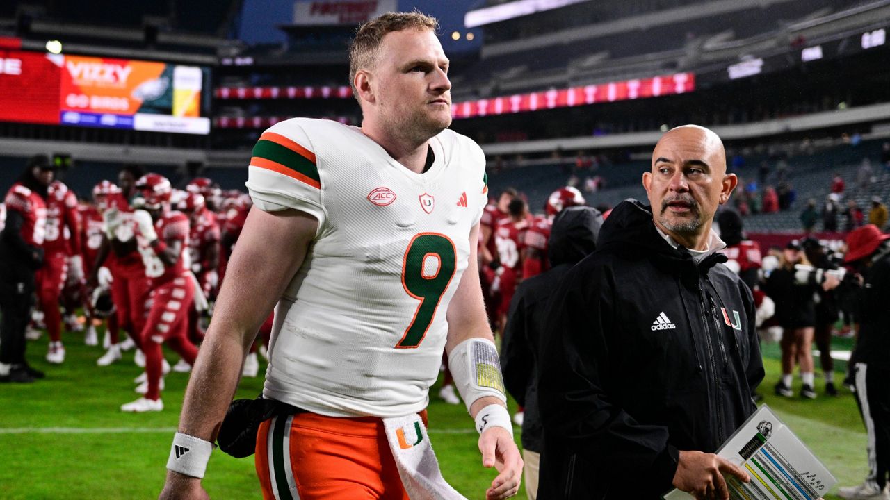 Miami quarterback Tyler Van Dyke (9) walks off the field after an NCAA college football game against Temple, Saturday, Sept. 23, 2023, in Philadelphia. (AP Photo/Derik Hamilton)