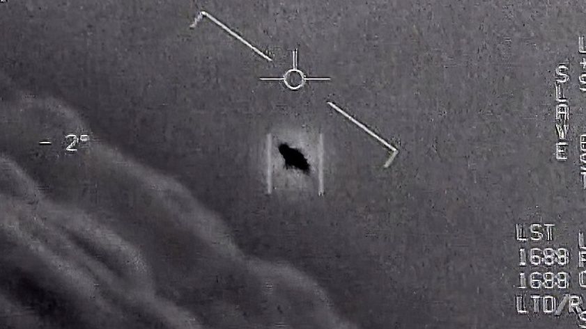 The image from video provided by the Department of Defense labelled Gimbal, from 2015, an unexplained object is seen at center as it is tracked as it soars high along the clouds. (Department of Defense via AP, File)