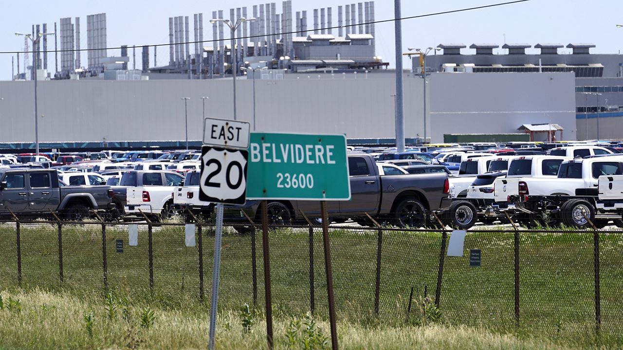 New vehicles sit in a parking lot waiting for transport at the former Fiat Chrysler Auto Plant, now owned by Stellantis, Monday, July 10, 2023, in Belvidere. Ill. (AP Photo/Charles Rex Arbogast)