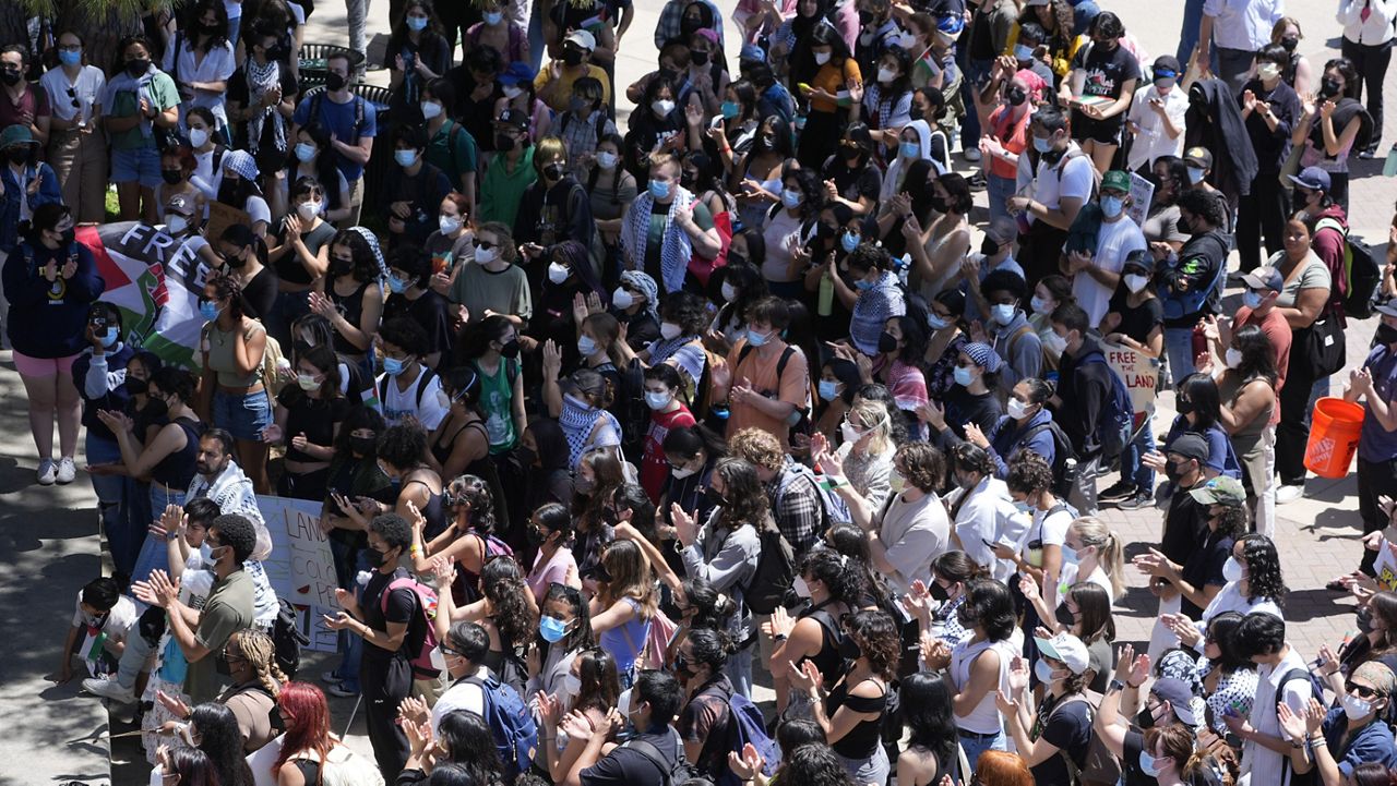 Students gather on the UCLA campus to protest the Israel-Hamas war, Monday, April 29, 2024, in Los Angeles. (AP Photo/Damian Dovarganes)