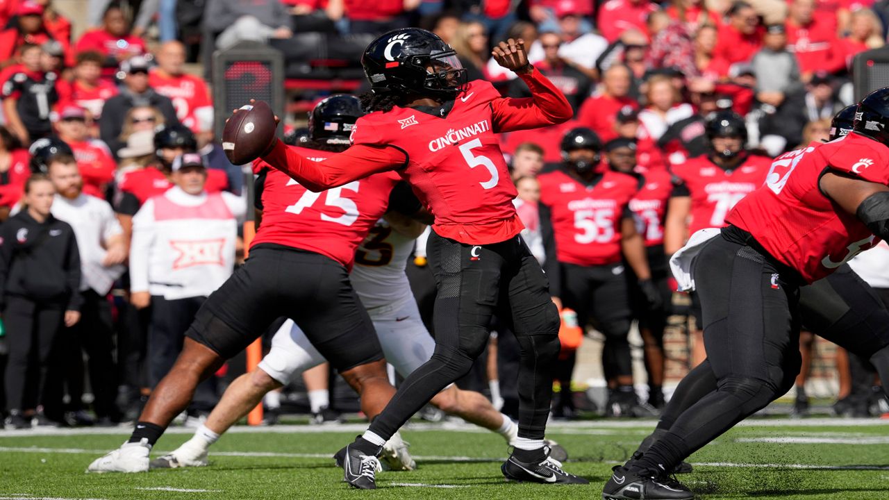 Cincinnati quarterback Emory Jones (5) throws a pass during the first half of an NCAA college football game against Iowa State, Saturday, Oct. 14, 2023, in Cincinnati. (AP Photo/Jeff Dean)