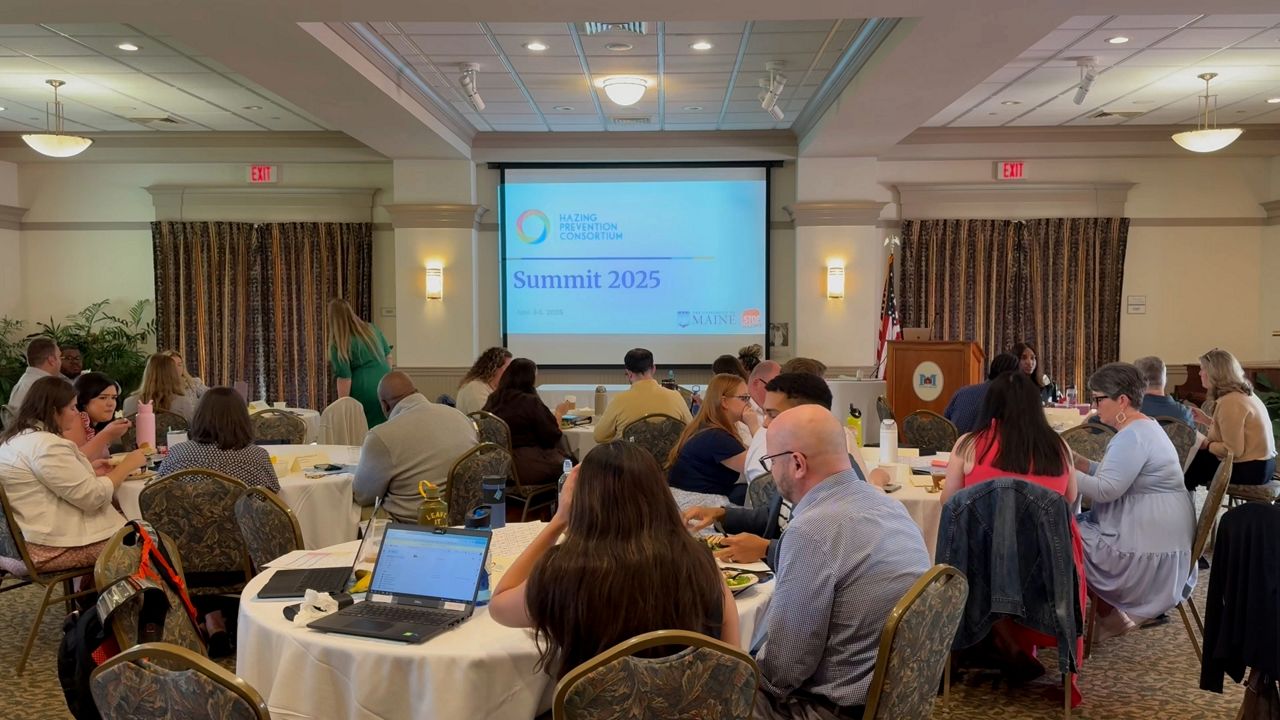 Representatives from higher education institutions across the country meet in UMaine’s Buchanan Alumni House on Thursday. (Spectrum News/David Ledford)