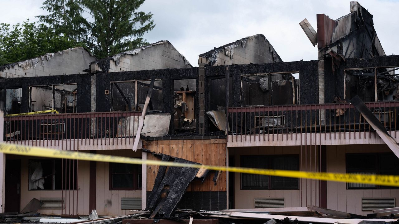 Suspect in fatal Knights Inn fire arraigned for parole violation, no further information from county